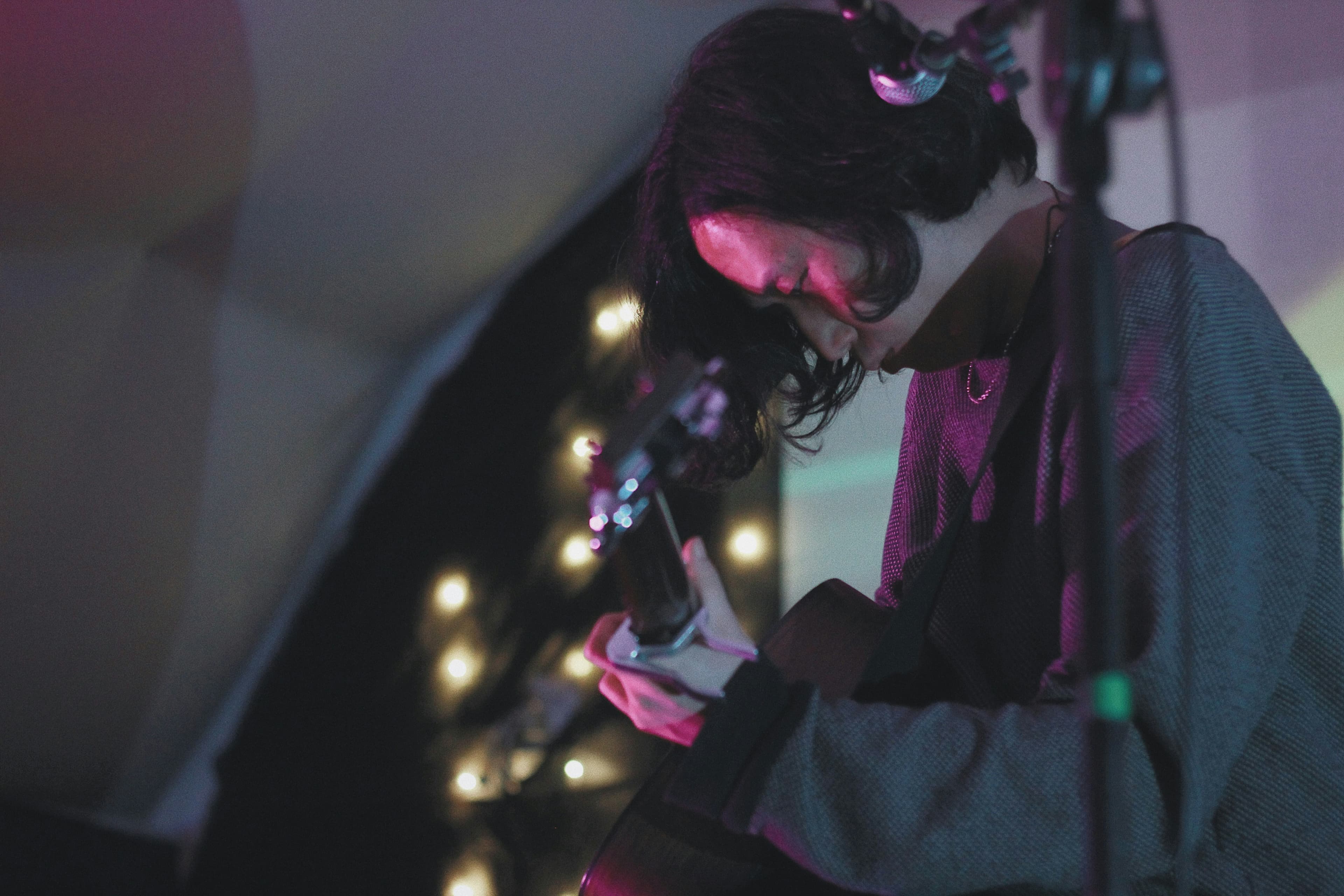 Musician in atmospheric pink lighting